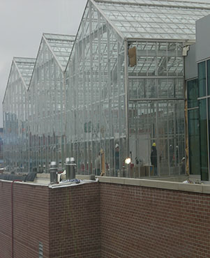 The new Downtown Market with its three pyramids of glass as seen from the highway.